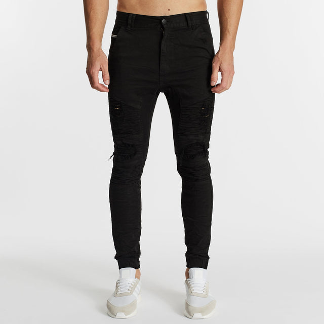 Model Wears Hellcat Pants Black Pants in Black - Image 4