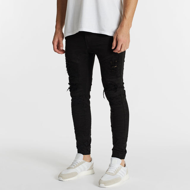 Model Wears Hellcat Pants Black Pants in Black - Image 3