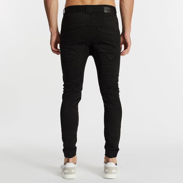 Model Wears Hellcat Pants Black Pants in Black - Image 6