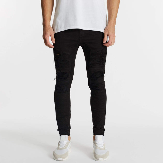 Model Wears Hellcat Pants Black Pants in Black - Image 1