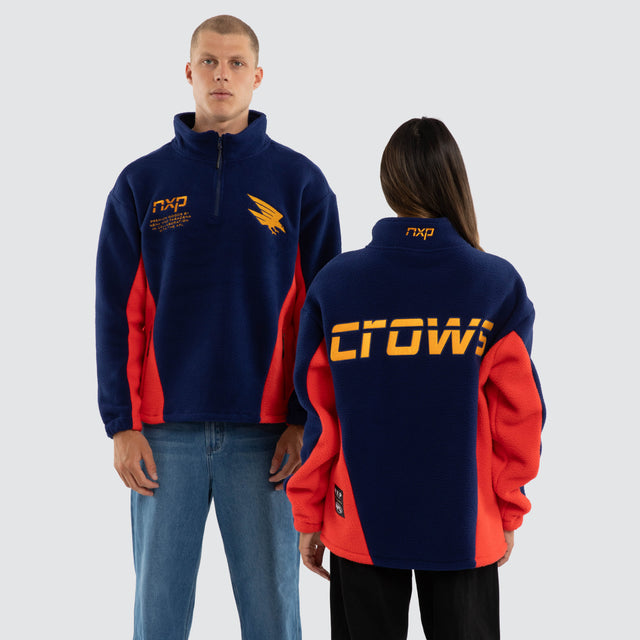 Model wears Adelaide Crows AFL Defence Pullover Navy Blue & Red Jumpers in Blue - Image 1