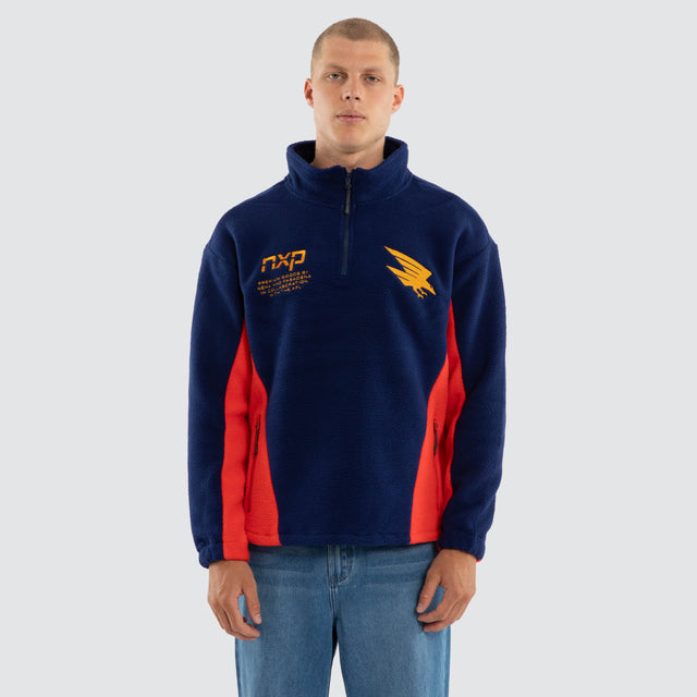 Model wears Adelaide Crows AFL Defence Pullover Navy Blue & Red Jumpers in Blue - Image 2