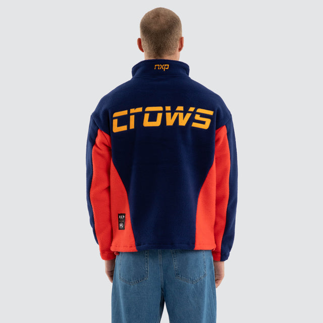 Model wears Adelaide Crows AFL Defence Pullover Navy Blue & Red Jumpers in Blue - Image 5
