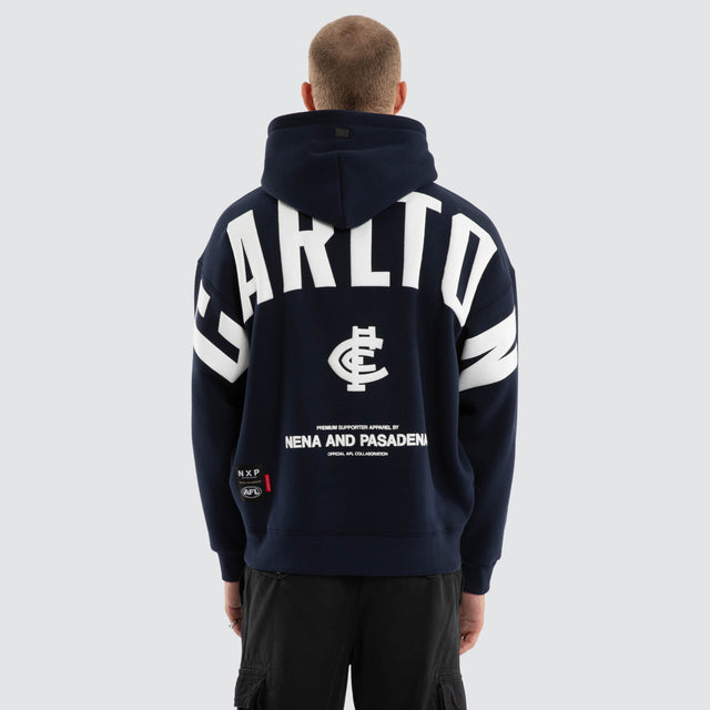 Model wears Carlton Blues AFL Top Tier Hoodie Navy Hoodies in Blue - Image 2