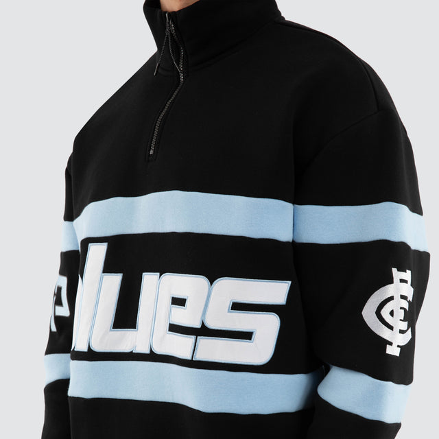Model wears Carlton Blues AFL Allied Pullover Jet Black Jumpers in Black - Image 4