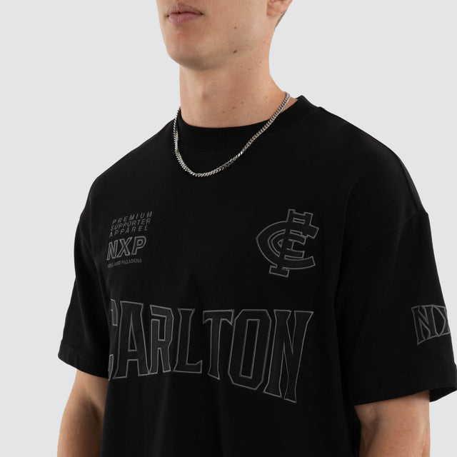 Model wears Carlton Blues AFL Perform Loopback Tee Jet Black T-Shirts in Black - Image 3