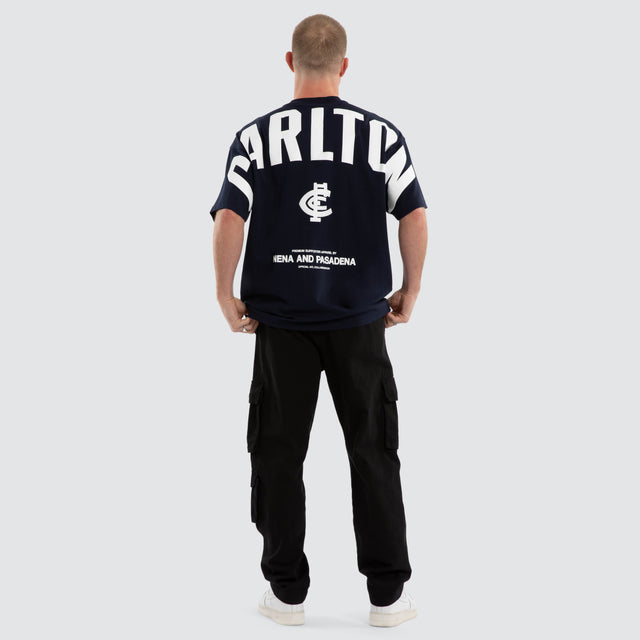 Model wears Carlton Blues AFL Archive Raptor Tee Navy T-Shirts in Blue - Image 4