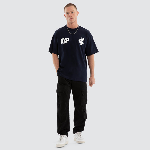 Model wears Carlton Blues AFL Archive Raptor Tee Navy T-Shirts in Blue - Image 5
