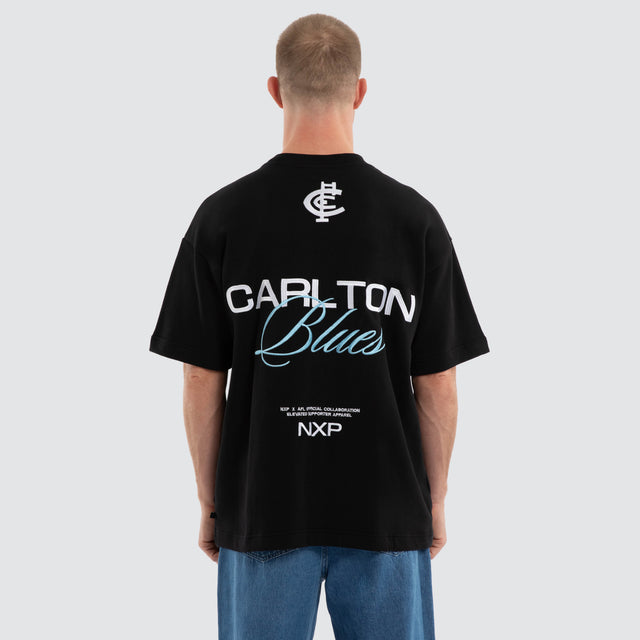 Model wears Carlton Blues AFL Advance Raptor Tee Jet Black T-Shirts in Black - Image 2
