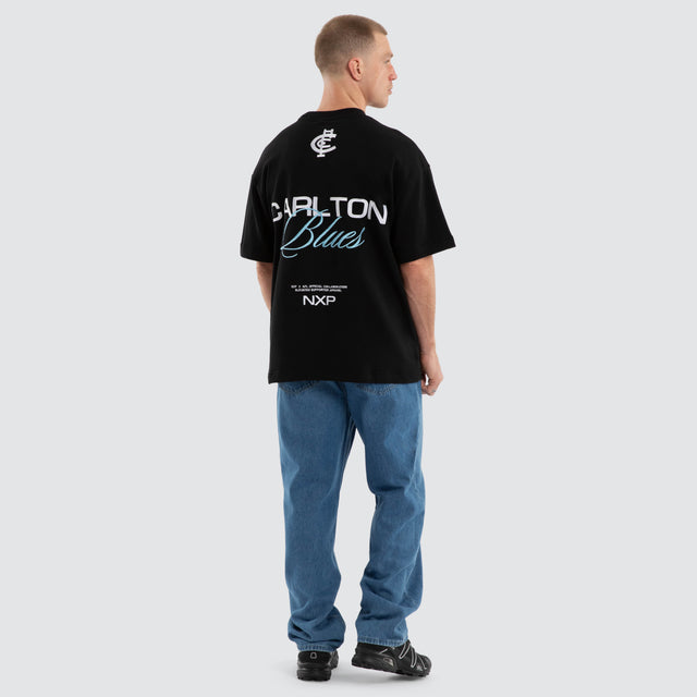 Model wears Carlton Blues AFL Advance Raptor Tee Jet Black T-Shirts in Black - Image 6