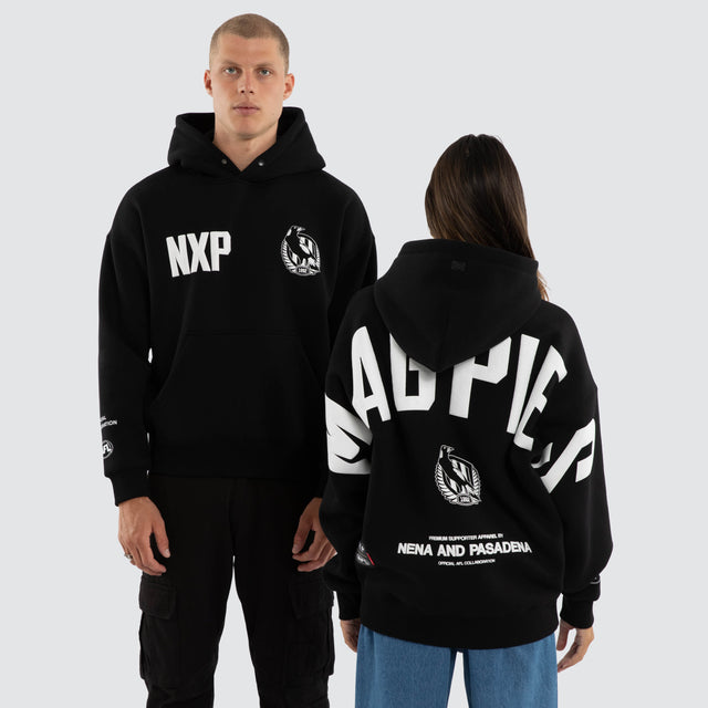 Model wears Collingwood Magpies AFL Top Tier Hoodie Jet Black Hoodies in Black - Image 1