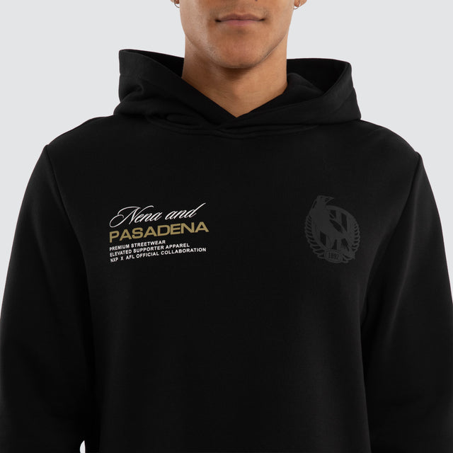 Model wears Collingwood Magpies AFL Recovery Hoodie Jet Black Hoodies in Black - Image 3