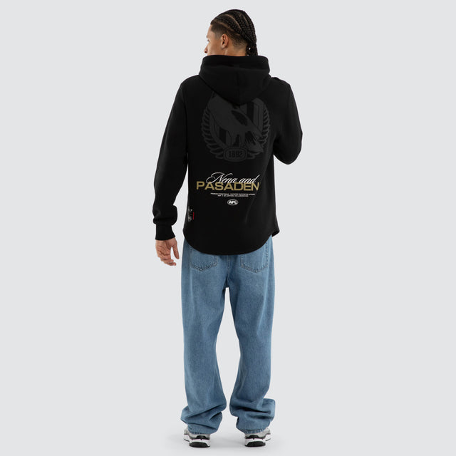 Model wears Collingwood Magpies AFL Recovery Hoodie Jet Black Hoodies in Black - Image 4