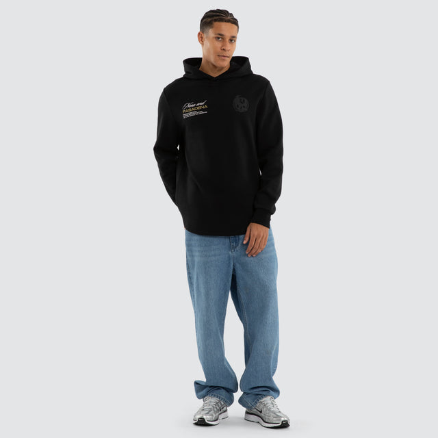 Model wears Collingwood Magpies AFL Recovery Hoodie Jet Black Hoodies in Black - Image 5