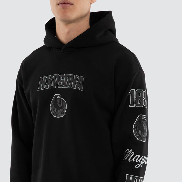 Model wears Collingwood Magpies AFL Simulation Hoodie Jet Black Hoodies in Black - Image 2
