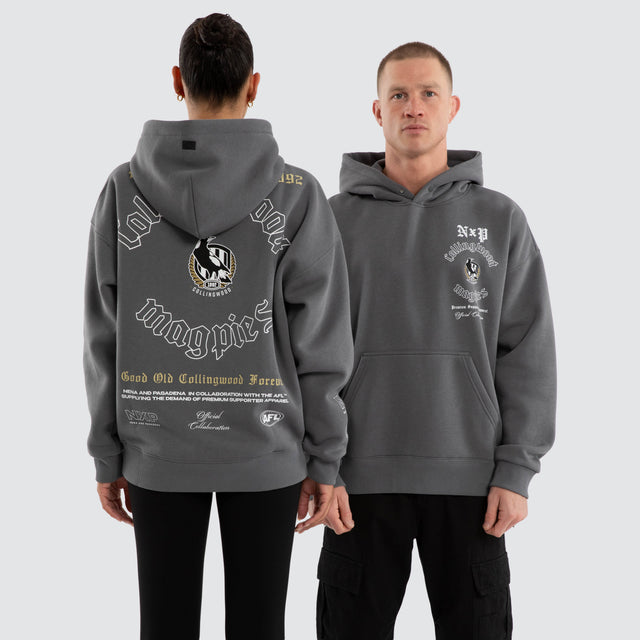 Model wears Collingwood Magpies AFL Tag Box Fit Hoodie Charcoal Hoodies in Grey - Image 1
