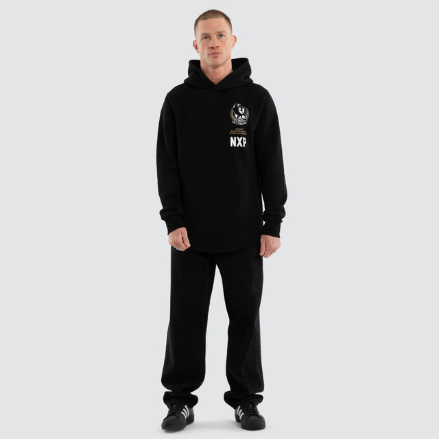 Model wears Collingwood Magpies AFL Trophy Curved Hem Hoodie Jet Black Hoodies in Black - Image 5