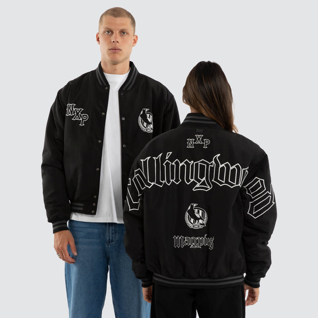 Model wears Collingwood Magpies AFL Retro Bomber Jet Black Jackets in Black - Image 1