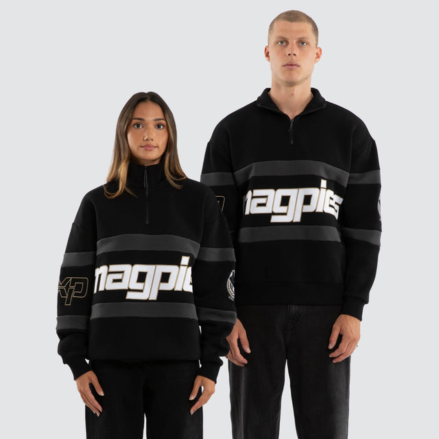 Model wears Collingwood Magpies AFL Allied Pullover Jet Black Jumpers in Black - Image 1