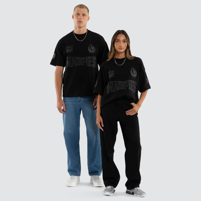 Model wears Collingwood Magpies AFL Perform Loopback Tee Jet Black T-Shirts in Black - Image 5