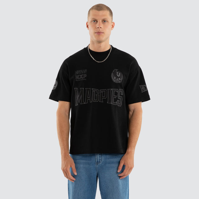 Model wears Collingwood Magpies AFL Perform Loopback Tee Jet Black T-Shirts in Black - Image 3