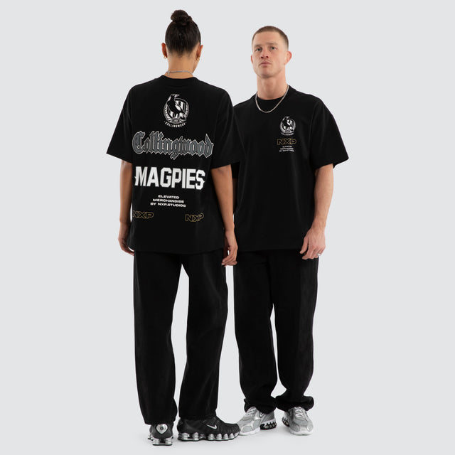 Model wears Collingwood Magpies AFL Sticker Raptor Tee Jet Black T-Shirts in Black - Image 3