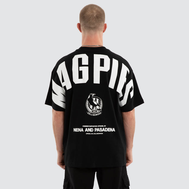 Model wears Collingwood Magpies AFL Archive Raptor Tee Jet Black T-Shirts in Black - Image 1