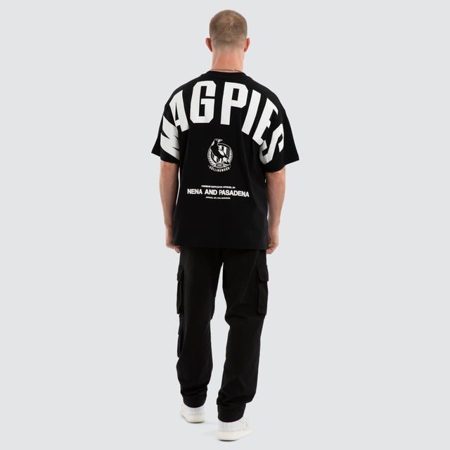 Model wears Collingwood Magpies AFL Archive Raptor Tee Jet Black T-Shirts in Black - Image 6