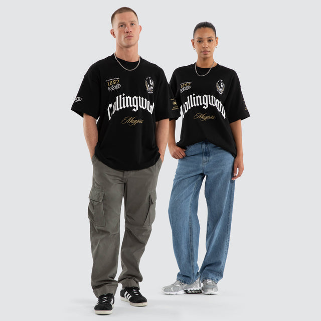 Model wears Collingwood Magpies AFL Gold Raptor Tee Jet Black T-Shirts in Black - Image 4