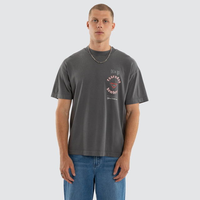 Model wears Essendon Bombers AFL Off-Season Tee Pigment Grey T-Shirts in Grey - Image 4