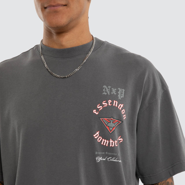 Model wears Essendon Bombers AFL Off-Season Tee Pigment Grey T-Shirts in Grey - Image 3