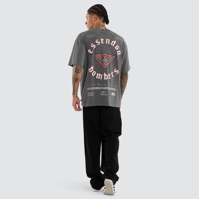 Model wears Essendon Bombers AFL Off-Season Tee Pigment Grey T-Shirts in Grey - Image 4