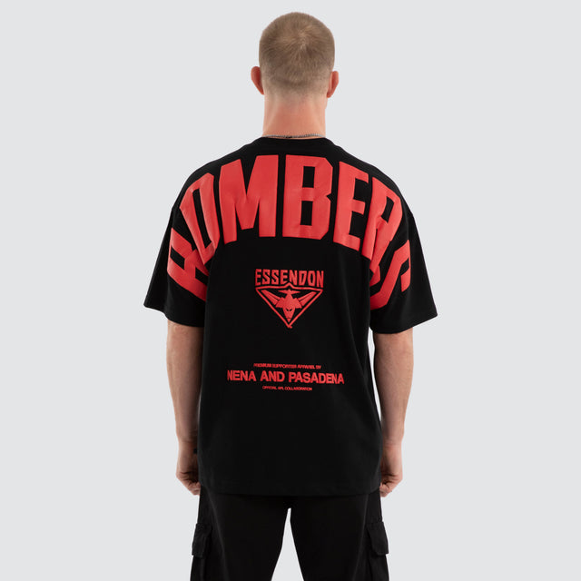 Model wears Essendon Bombers AFL Archive Raptor Tee Jet Black T-Shirts in Black - Image 1