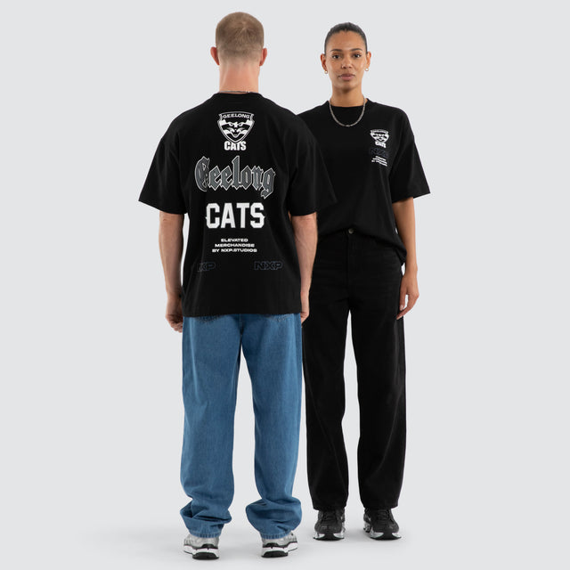 Model wears Geelong Cats AFL Sticker Raptor Tee Jet Black T-Shirts in Black - Image 4