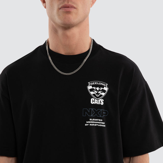 Model wears Geelong Cats AFL Sticker Raptor Tee Jet Black T-Shirts in Black - Image 5