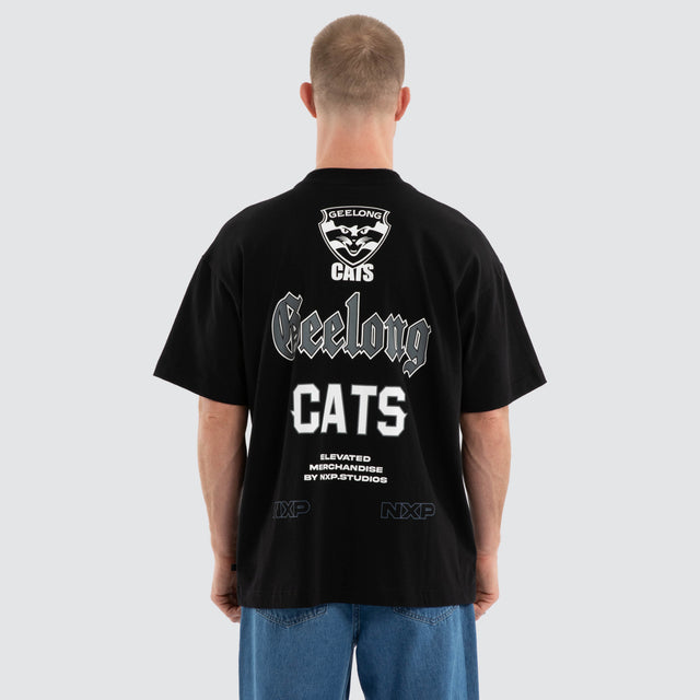 Model wears Geelong Cats AFL Sticker Raptor Tee Jet Black T-Shirts in Black - Image 3