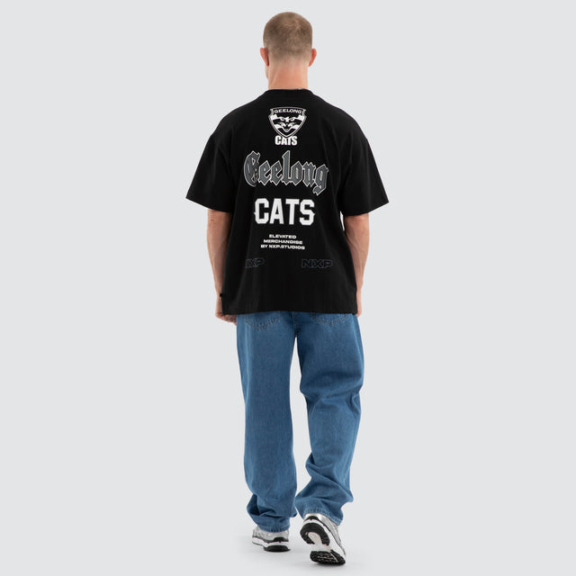 Model wears Geelong Cats AFL Sticker Raptor Tee Jet Black T-Shirts in Black - Image 6