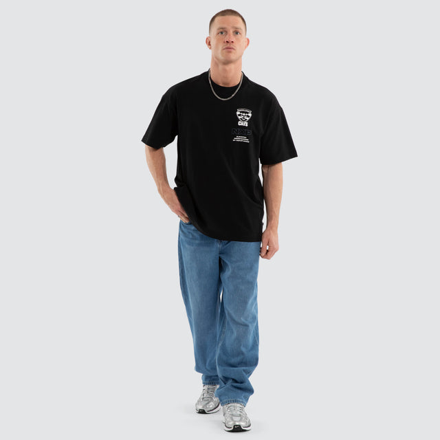 Model wears Geelong Cats AFL Sticker Raptor Tee Jet Black T-Shirts in Black - Image 7