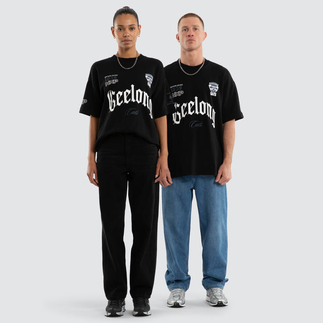 Model wears Geelong Cats AFL Gold Raptor Tee Jet Black T-Shirts in Black - Image 5