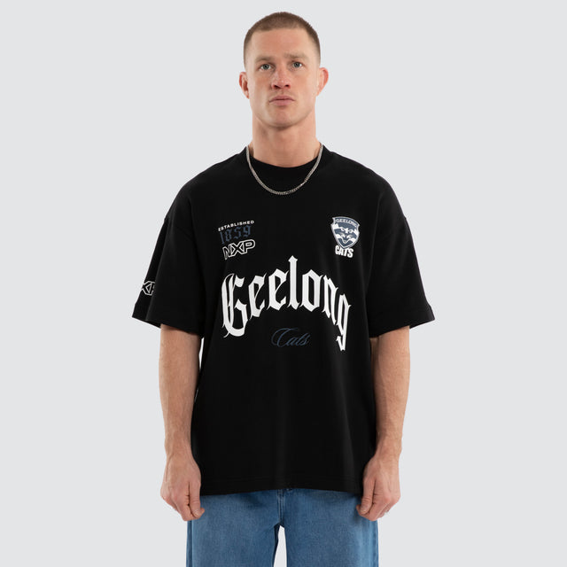Model wears Geelong Cats AFL Gold Raptor Tee Jet Black T-Shirts in Black - Image 3