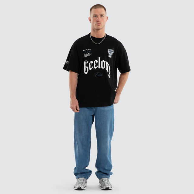 Model wears Geelong Cats AFL Gold Raptor Tee Jet Black T-Shirts in Black - Image 7