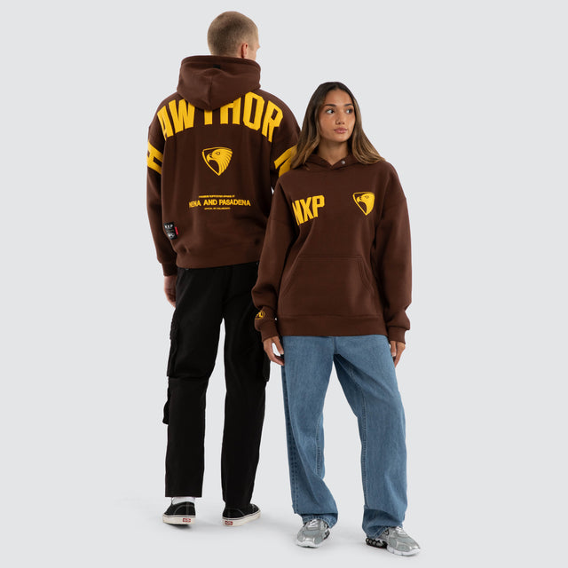 Model wears Hawthorn Hawks AFL Top Tier Hoodie Brown Hoodies in Brown - Image 5