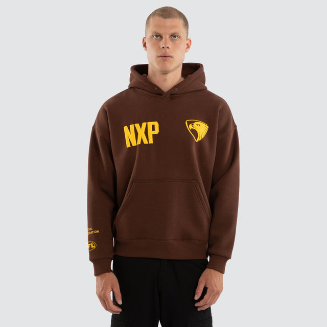 Model wears Hawthorn Hawks AFL Top Tier Hoodie Brown Hoodies in Brown - Image 4