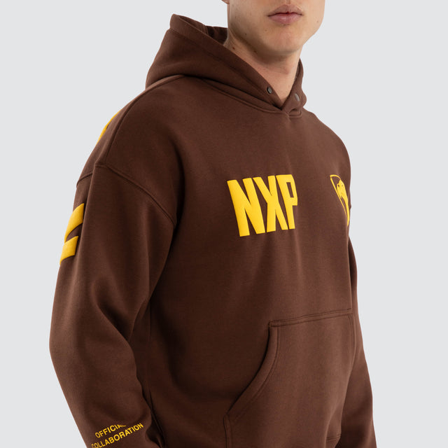 Model wears Hawthorn Hawks AFL Top Tier Hoodie Brown Hoodies in Brown - Image 3