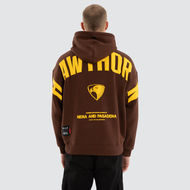 Model wears Hawthorn Hawks AFL Top Tier Hoodie Brown Hoodies in Brown - Image 2