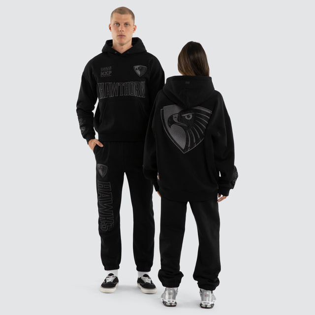 Model wears Hawthorn Hawks AFL Persistent Hoodie Jet Black Hoodies in Black - Image 5