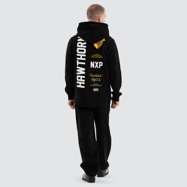 Model wears Hawthorn Hawks AFL Trophy Curved Hem Hoodie Jet Black Hoodies in Black - Image 4