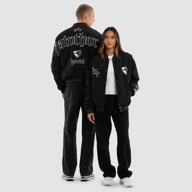 Model wears Hawthorn Hawks AFL Retro Bomber Jet Black Jackets in Black - Image 5