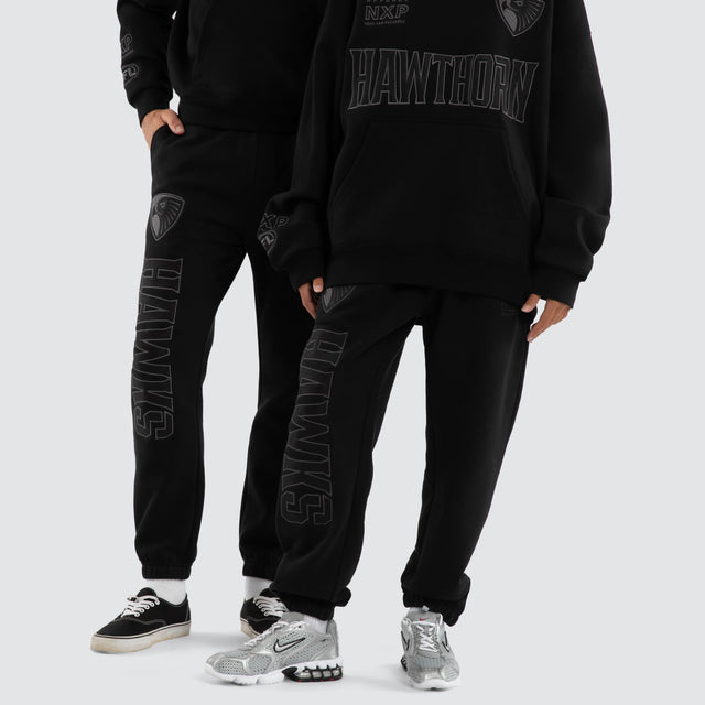 Model wears Hawthorn Hawks AFL Perform Trackpant Jet Black Trackpants in Black - Image 2
