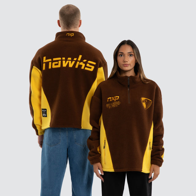 Model wears Hawthorn Hawks AFL Defence Pullover Brown & Yellow Jumpers in Brown - Image 1